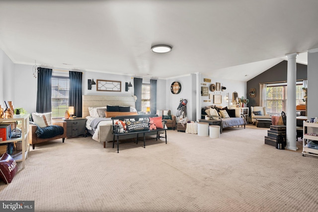 carpeted bedroom with decorative columns, ornamental molding, and vaulted ceiling