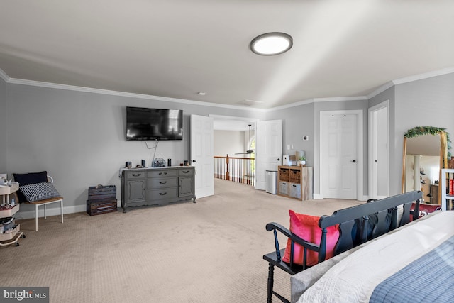 bedroom featuring ornamental molding and carpet floors