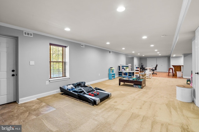 interior space with ornamental molding and light carpet