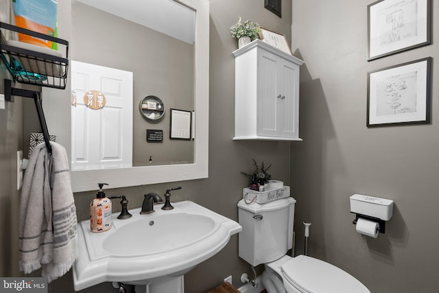 bathroom with sink and toilet