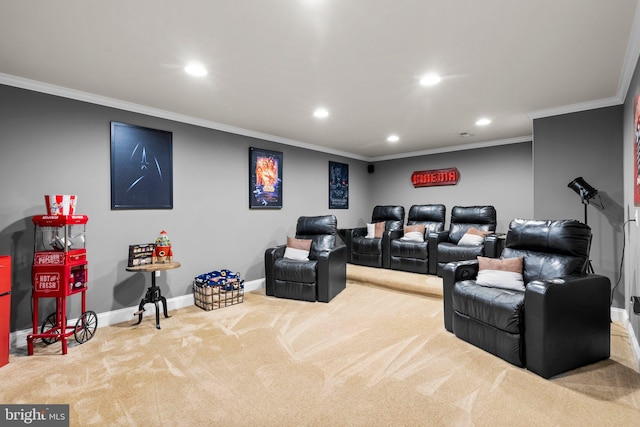 cinema room featuring ornamental molding and light colored carpet