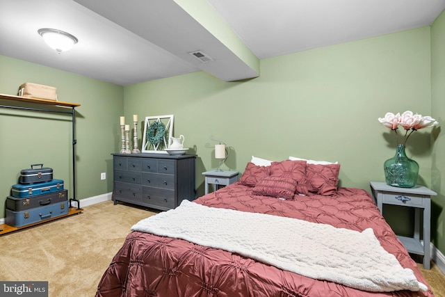 bedroom featuring light carpet