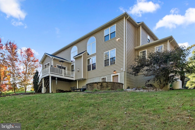 view of side of home featuring a wooden deck and a yard