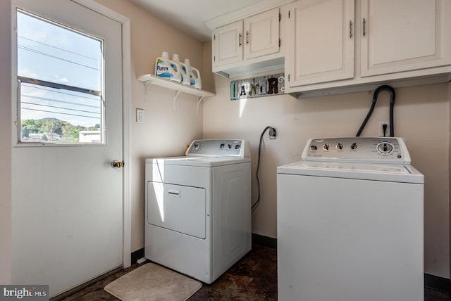 washroom featuring cabinets and washing machine and dryer