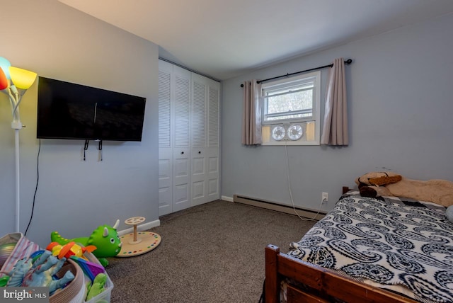 carpeted bedroom with a closet and a baseboard heating unit