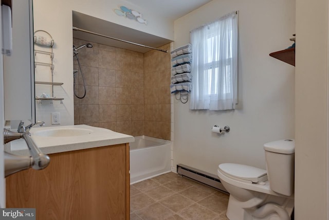 full bathroom featuring toilet, tiled shower / bath combo, baseboard heating, and vanity