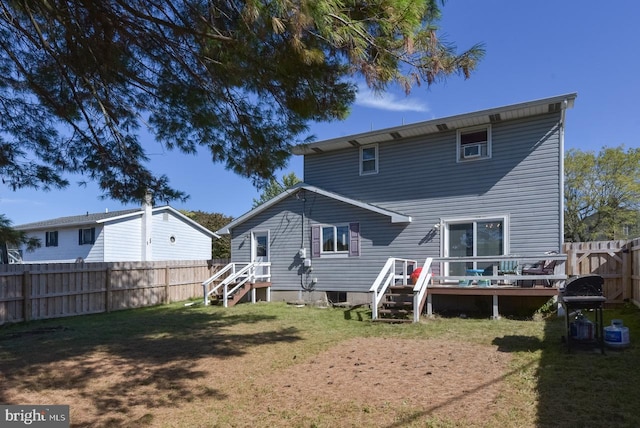 rear view of property featuring a lawn