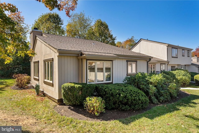 view of home's exterior featuring a lawn