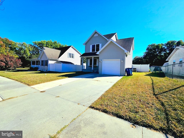 front of property featuring a front lawn and a garage