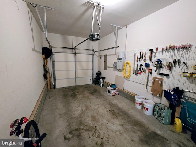 garage with a garage door opener and electric panel