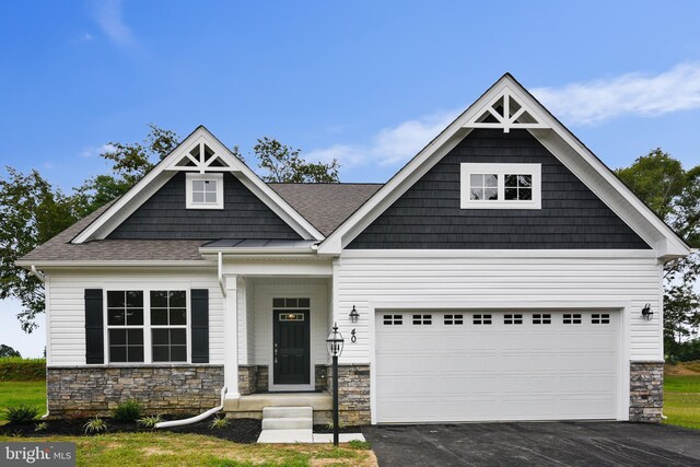 craftsman inspired home featuring a garage