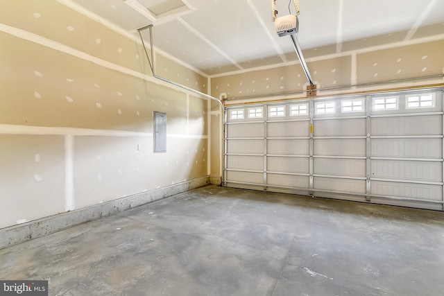 garage featuring a garage door opener and electric panel