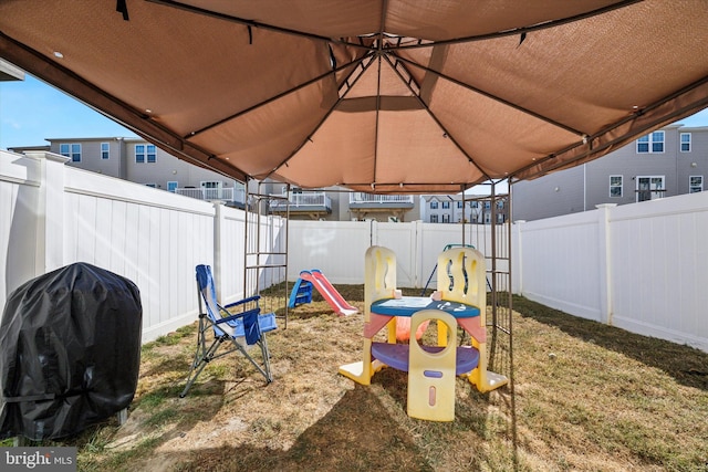 view of play area featuring a yard