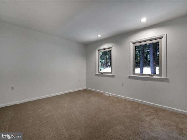 empty room featuring carpet floors