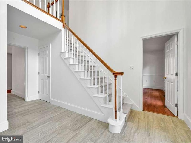 stairway featuring hardwood / wood-style flooring