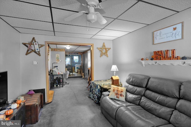 carpeted living room featuring a paneled ceiling and ceiling fan