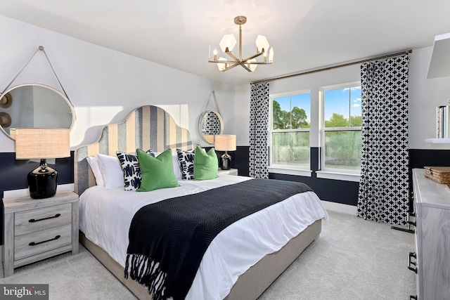 carpeted bedroom with an inviting chandelier