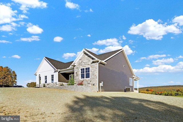 view of side of home featuring central air condition unit