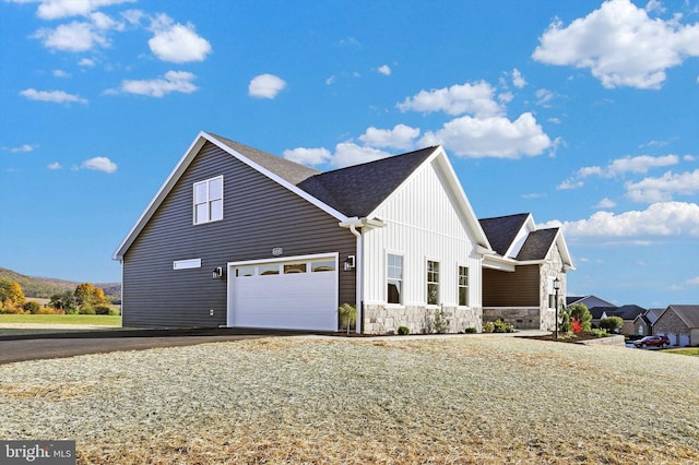 view of side of home with a garage