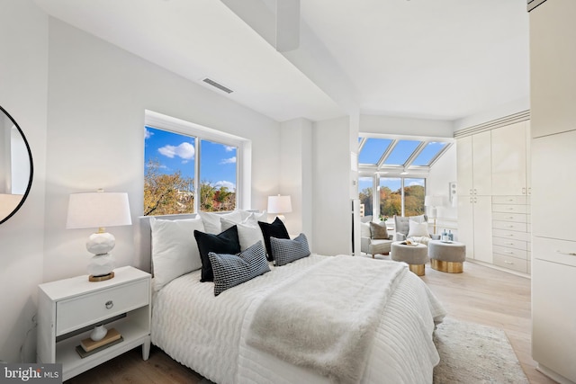 bedroom with light wood-type flooring