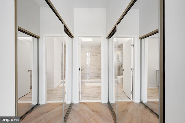 bathroom with hardwood / wood-style floors