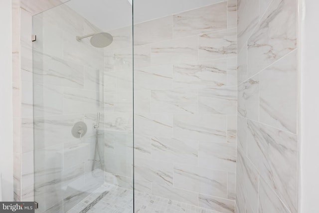 bathroom with tiled shower