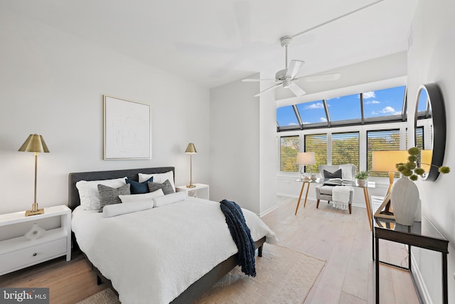 bedroom featuring hardwood / wood-style flooring and ceiling fan