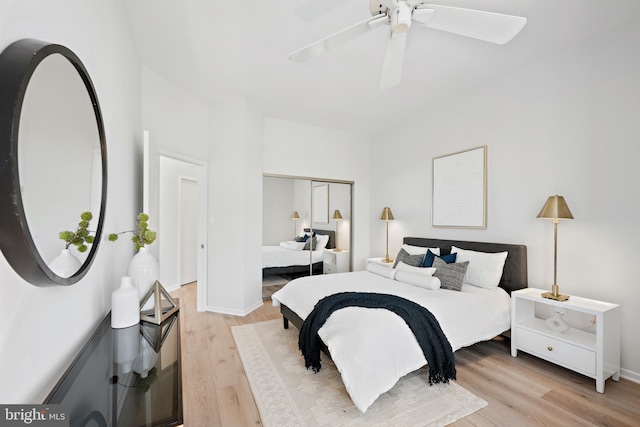 bedroom featuring a closet, light hardwood / wood-style floors, and ceiling fan