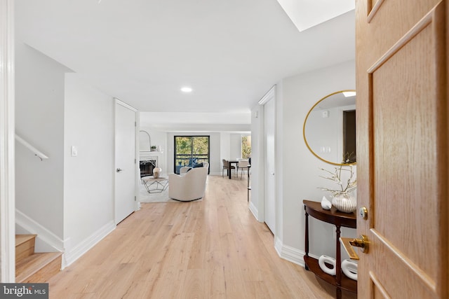 hallway with light wood-type flooring