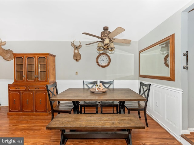 dining area with ceiling fan and light wood-type flooring