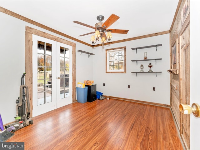 unfurnished room with french doors, a wealth of natural light, light hardwood / wood-style floors, and crown molding