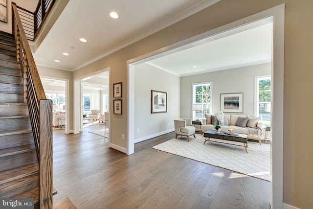 interior space featuring baseboards, recessed lighting, stairway, crown molding, and dark wood-type flooring