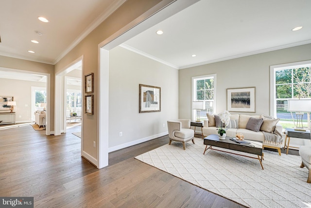 living room featuring recessed lighting, wood finished floors, and crown molding