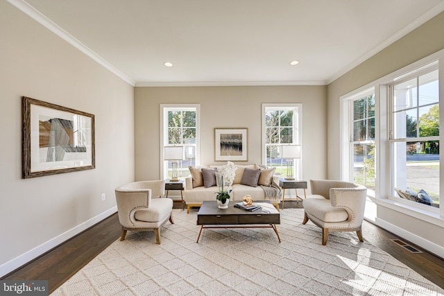 living room featuring plenty of natural light, wood finished floors, and visible vents