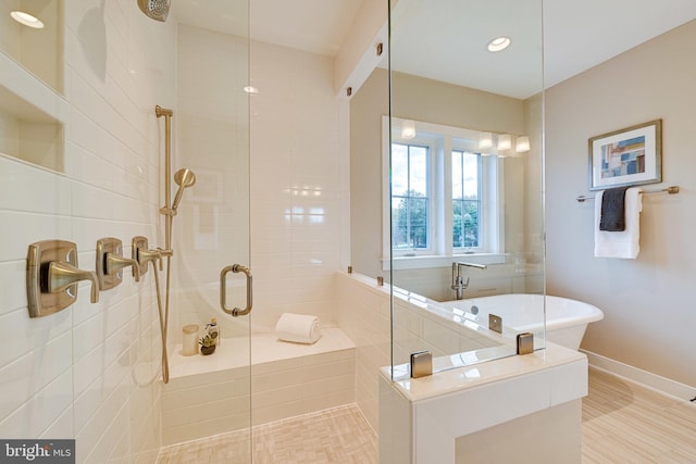 bathroom featuring plus walk in shower and tile patterned flooring