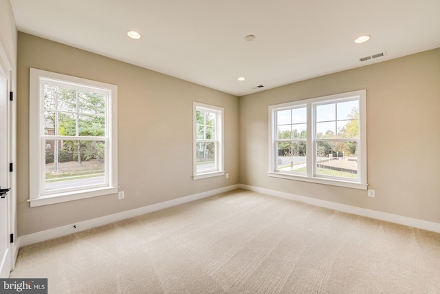 empty room featuring light colored carpet