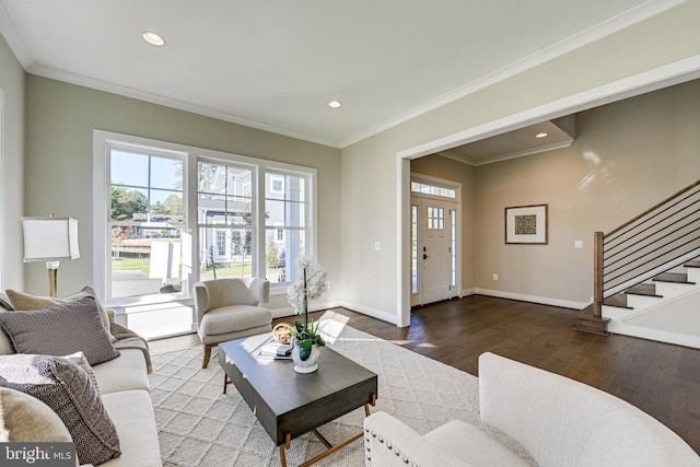 living area featuring baseboards, recessed lighting, wood finished floors, stairway, and crown molding