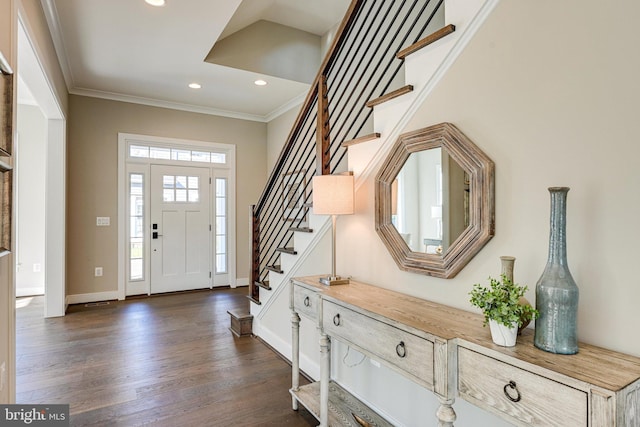 foyer featuring crown molding and dark hardwood / wood-style flooring