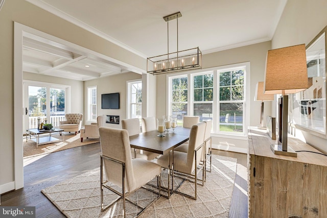 dining room featuring wood-type flooring, coffered ceiling, beamed ceiling, ornamental molding, and an inviting chandelier