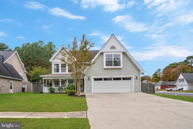 front of property featuring covered porch, a garage, and a front yard