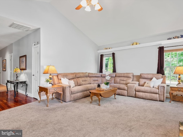 living room featuring vaulted ceiling, hardwood / wood-style flooring, and ceiling fan