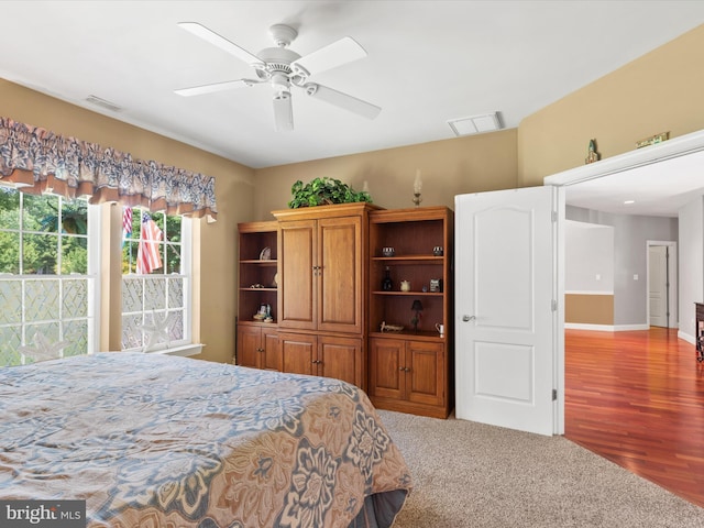 bedroom with ceiling fan and hardwood / wood-style floors