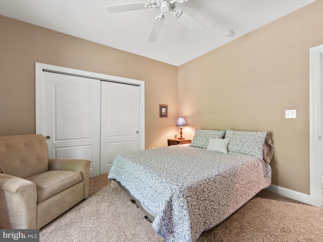 carpeted bedroom with a closet and ceiling fan