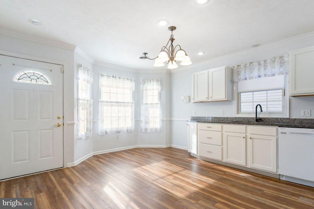 kitchen featuring white cabinetry, decorative light fixtures, white dishwasher, and dark hardwood / wood-style flooring