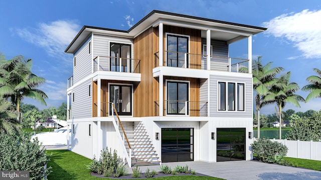 contemporary home featuring a front lawn and a balcony