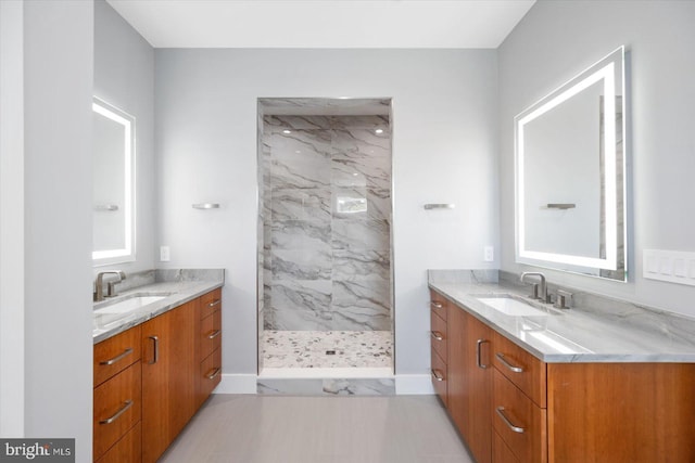 bathroom featuring vanity and a tile shower