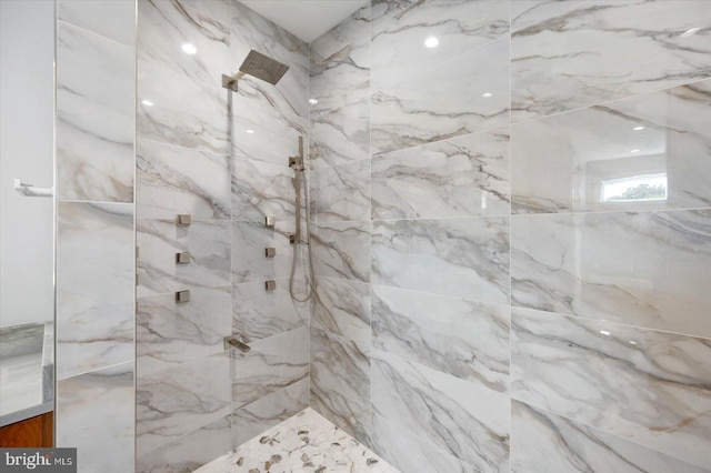 bathroom with a tile shower