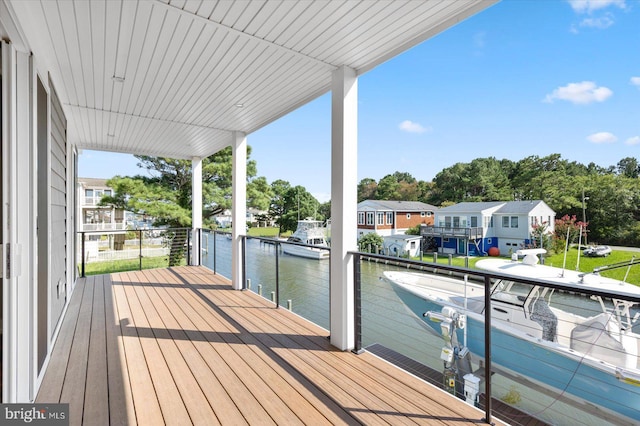 exterior space featuring a dock and a water view