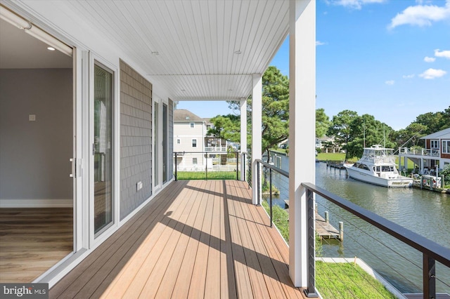 deck with a water view and a boat dock