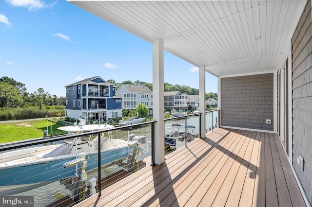 deck featuring a dock and a water view